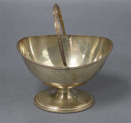 A Victorian engraved silver sugar basket, Robert Harper, London, 1867, 7.5 oz.